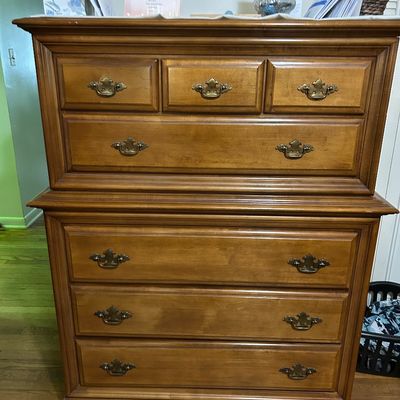 Sale Photo Thumbnail #117: Vintage Ethan Allen style cherry wood chest-on-chest dresser featuring brass batwing drawer pulls and a bracket base.