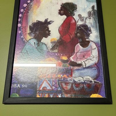 Sale Photo Thumbnail #88: Framed art print depicting three women at a market, signed and dated '95 in the lower left corner, housed in a simple black frame.