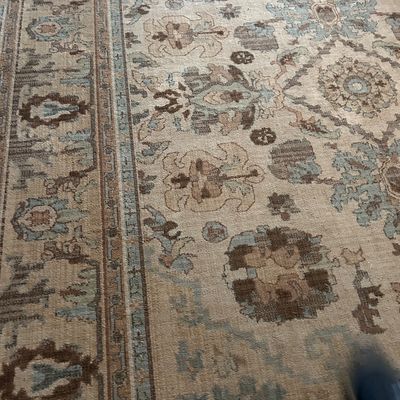 Sale Photo Thumbnail #108: Traditional Persian-style area rug featuring a muted palette of beige, brown, and soft blue with intricate floral and geometric motifs.