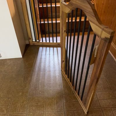 Sale Photo Thumbnail #52: Pair of rustic wooden pet or baby gates featuring arched tops and black metal spindles.