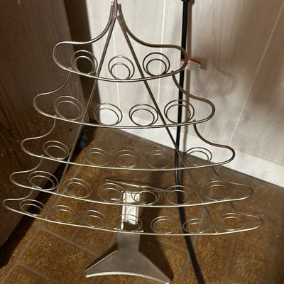 Sale Photo Thumbnail #59: Christmas tree-shaped metal wire display stand, featuring multiple circular holders for ornaments or small items.