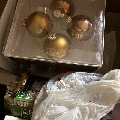 Sale Photo Thumbnail #58: Boxed set of four gold-toned glass Christmas ball ornaments with decorative patterns, shown alongside holiday light sets.
