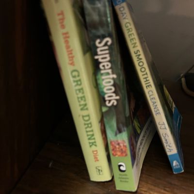 Sale Photo Thumbnail #12: Three paperback books on health and nutrition, including "The Healthy Green Drink Diet," "Superfoods," and "10-Day Green Smoothie Cleanse" by JJ Smith.