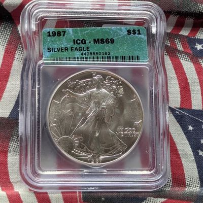 Sale Photo Thumbnail #150: 1987 American Silver Eagle 1 Troy Oz. .999 Fine Silver ICG MS69