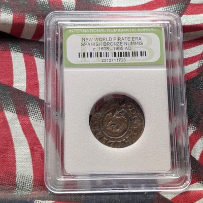 Sale Photo Thumbnail #413: c. 1608-1695 AD New World Pirate Era Spanish Bronze Nummis Coin - Slabbed International Numismatic Bureau