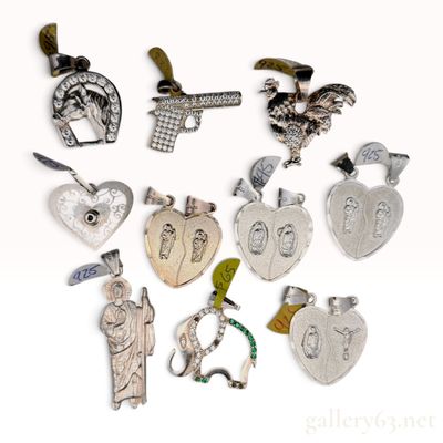 A Collection of Sterling Silver and Cubic Zirconia Assorted Pendants
