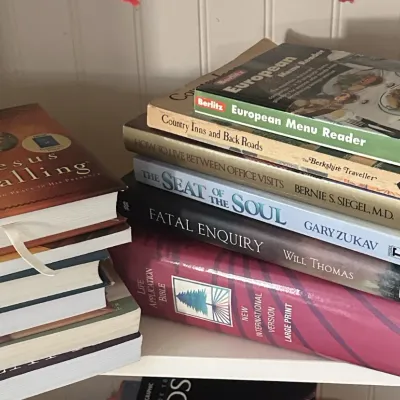 Sale Photo Thumbnail #37: Two stacks of assorted books, including titles such as "Jesus Calling," "The Seat of the Soul," and a large print "Life Application Bible."