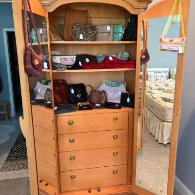 Sale Photo Thumbnail #96: Inside of armoire with mirrored doors, featuring a shell-carved top, interior shelves, and four drawers.  Made by Bernhardt.