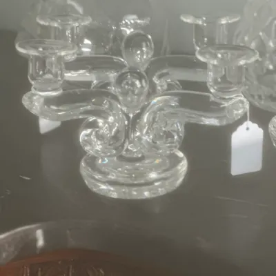 Sale Photo Thumbnail #53: Vintage clear glass multi-lite candelabra featuring elegant scrolled arms and a sturdy round base.