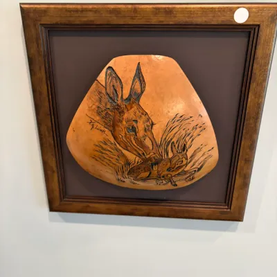 Sale Photo Thumbnail #33: Framed rustic wildlife art piece featuring a carved gourd fragment depicting a doe and fawn, signed by H.G. Link.
