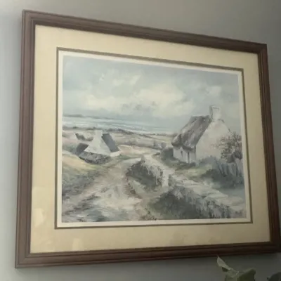 Sale Photo Thumbnail #28: Framed landscape print depicting a coastal cottage scene with a stone wall and dirt path, presented in a double mat and a simple wooden frame.