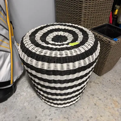 Sale Photo Thumbnail #64: Modern black and white woven resin wicker stool or side table featuring a bold striped and concentric circle pattern.