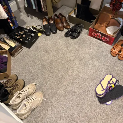 Sale Photo Thumbnail #46: Assortment of women's footwear including Dingo boots, hiking boots, athletic sneakers, loafers, and sandals in various styles and sizes.