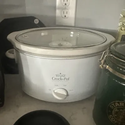 Sale Photo Thumbnail #14: Vintage Rival Crock-Pot slow cooker in white with a glass lid, featuring low, high, and warm settings.