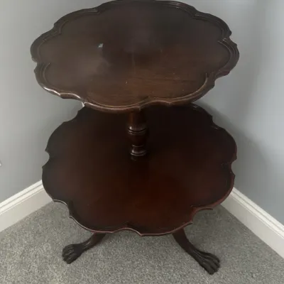 Sale Photo Thumbnail #7: Vintage mahogany two-tier dumbwaiter table featuring scalloped piecrust edges and claw-and-ball feet.