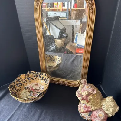 A Couple of Pieces Of Decor And A Mirror