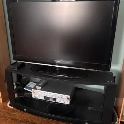 Samsung 46” TV, Panasonic DVD/VHS Player & TV Stand