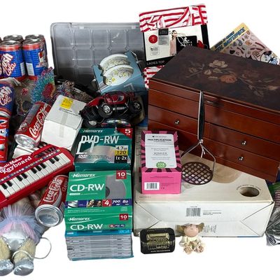 Sale Photo Thumbnail #693: A Collection of Collectible Cans, Media, Textiles, and Household Goods