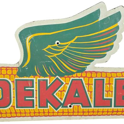 Sale Photo Thumbnail #818: Vintage Die-Cut Painted Hardboard DeKalb Winged Ear Advertising Sign