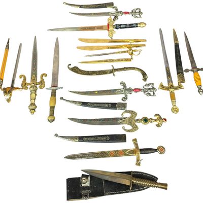 Sale Photo Thumbnail #129: An Assortment of Decorative Daggers and Miniature Sword Letter Openers
