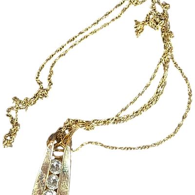 Sale Photo Thumbnail #229: 14 Karat Yellow Gold Three Stone Diamond Bypass Pendant Necklace