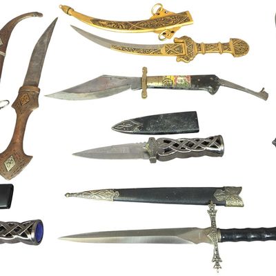Sale Photo Thumbnail #137: An Assortment of Ten Decorative and Collectible Edged Weapons and Daggers