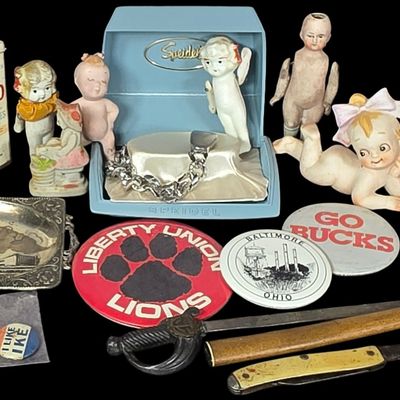 Sale Photo Thumbnail #800: An Assortment of Vintage Souvenirs, Bisque Dolls, and Advertising Items Including Speidel and Johnson and Johnson