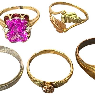 Sale Photo Thumbnail #220: A Collection of Five 10 Karat Yellow Gold Rings Including Black Hills Style Designs