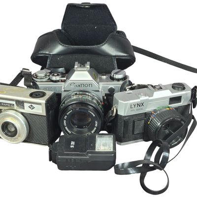 Sale Photo Thumbnail #569: Three Vintage Cameras and Electronic Flash Unit including a Canon AE-1