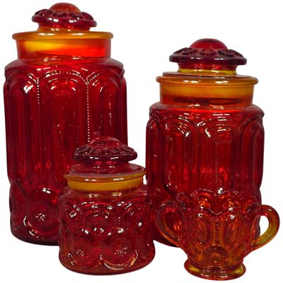 Sale Photo Thumbnail #489: Three Mid-Century Amberina Glass Moon and Star Pattern Canisters and Sugar Bowl