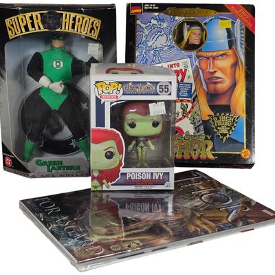 Sale Photo Thumbnail #329: A Collection of DC and Marvel Superhero Collectibles Including Figures and Graphic Novel