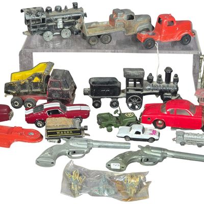 Sale Photo Thumbnail #285: An Assortment of Vintage Die-Cast Vehicles, Cast Iron Trains, and Toy Weapons Including Dinky Toys, Tonka, Ertl, and Hubley
