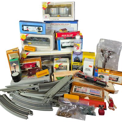Sale Photo Thumbnail #868: A Collection of Vintage HO Scale Model Railroad Locomotives, Rolling Stock, Track, and Accessories Including Bachmann Plus, Tyco, and Model Power