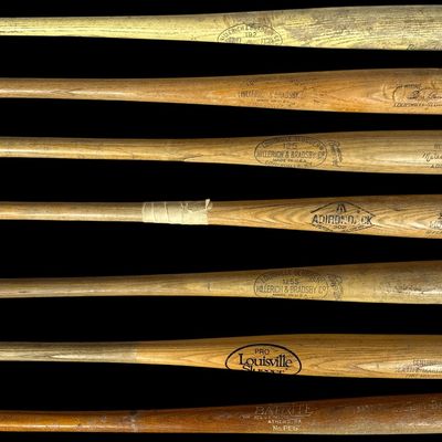 Sale Photo Thumbnail #687: An Assortment of Vintage Wooden Baseball and Softball Bats Including Louisville Slugger and Adirondack Models