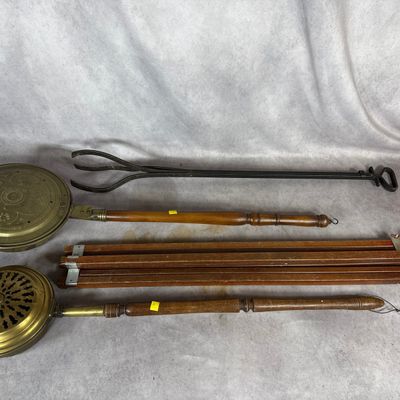 Sale Photo Thumbnail #668: An Assortment of Antique Brass Bed Warmers, Wrought Iron Hearth Tongs, and a Vintage Anco Folding Easel
