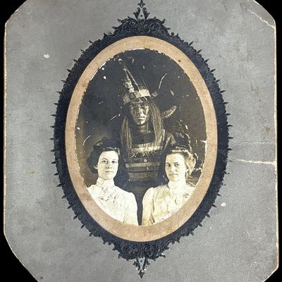 Sale Photo Thumbnail #746: Antique Photograph of Native American Man in Regalia with Two Young Women