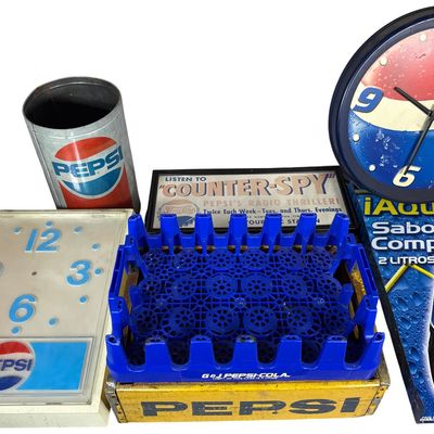 Sale Photo Thumbnail #678: A Collection of Pepsi-Cola Branded Advertising Signs, Clocks, and Delivery Crates