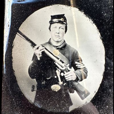 Sale Photo Thumbnail #758: Civil War 1/6 Plate Ruby Glass Ambrotype of a Union Corporal with Musket