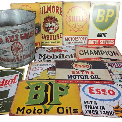 Sale Photo Thumbnail #844: A Standard Oil Company Mica Axle Grease Bucket and a Collection of Tin Advertising Signs