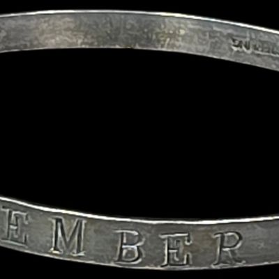 Sale Photo Thumbnail #92: A World War II Era Sterling Silver Remember Pearl Harbor Bangle