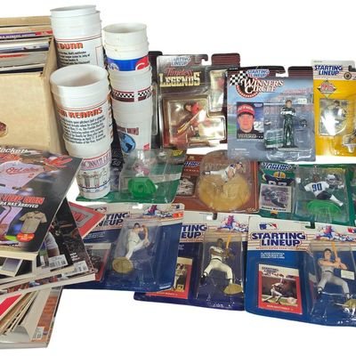Sale Photo Thumbnail #819: A Collection of Sports Memorabilia Including Action Figures Stadium Cups and Periodicals