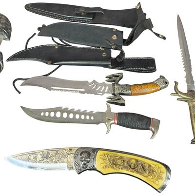 Sale Photo Thumbnail #131: A Collection of Decorative Fantasy and Survival Fixed-Blade Knives and a Large Folding Knife