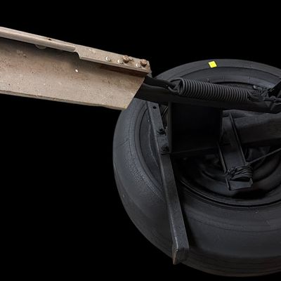 Sale Photo Thumbnail #832: Mechanical Spring Loaded Clay Pigeon Thrower Mounted on Spare Wheel
