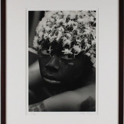 Valdir Cruz, Brazilian 1954-, Man with Painted Face and Buzzard Feather, Gelatin Silver Print,