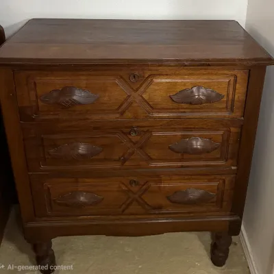 Sale Photo Thumbnail #11: An antique oak 3-drawer chest with decorative carved door pulls