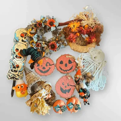 Autumn and Halloween Decor Including Wreaths, Painted Wood Slices, Plush Pumpkins, and Figurines