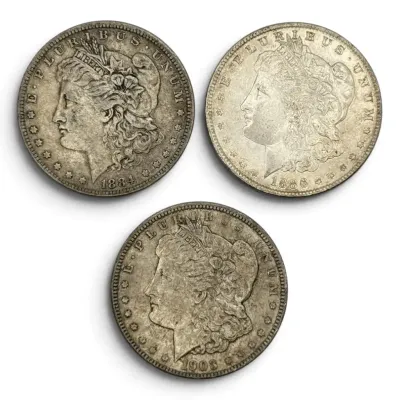 Three Morgan Silver Dollars- 1884, 1886, 1903
