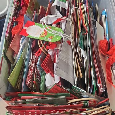 Assorted Holiday Gift Bags in Storage Bin