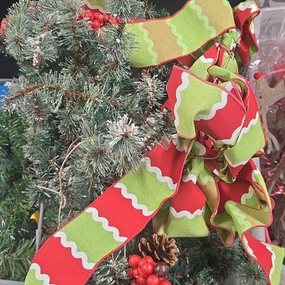 Artificial Christmas Pine Swag with Red and Green Wavy Ribbon and Pinecones