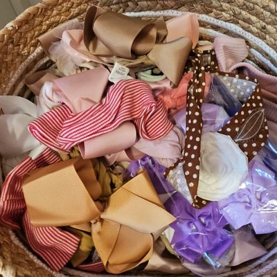 Assorted Children's Hair Bows and Accessories in Woven Basket